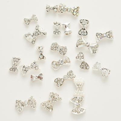 China nail Gem Nail art link shape Alloy Decorations Silver Bowknot Diamond Charms Mix Styles 3d rhinestone pearl bow nail bow for sale