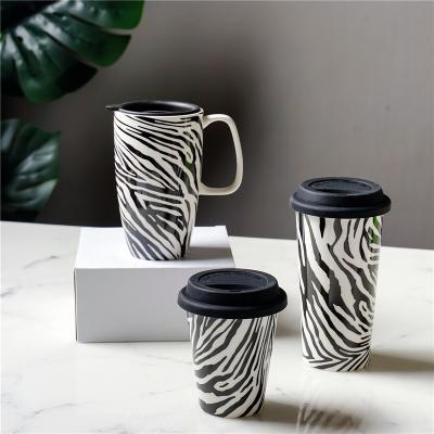 China Customized Viable Coffee Cup Coffee Mug Customized Logo And Color Wholesale Good Quality Double Wall Ceramic Mugs With Silicone Lid White Chalk for sale