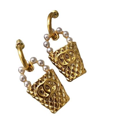 China The latest CLASSIC luxury famous alloy designer brand earrings designer earrings for cute girls for sale