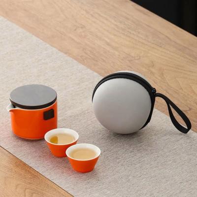 China Travel Viable Orange Ceramic Portable Tea Set Teapot and Outdoor Portable Tea Cup for sale