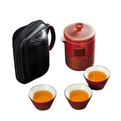 China Viable Ceramic Tea Set 3 Pcs Portable Chinese Style Travel Kungfu Teapot Set For Tea Making for sale