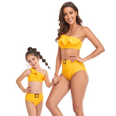 China Matching mommy and me new family 2022 European American wholesale breathable children's oblique bikini swimwear girls off shoulder swimwear for sale