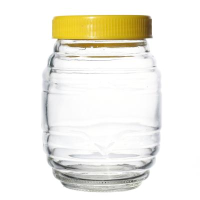 China Canned Food Manufacturer Wholesale Glassware Flint Customize High Quality Stripe Around Food Honey Jar Glass With The Screw Lid for sale