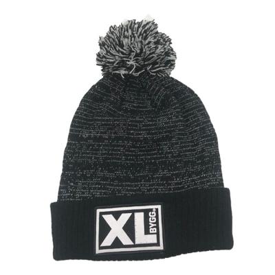 China COMMON Double Color Pompom Beanie Jacquard Hat Sports Skullcap With Embroidered Custom Woven Label for sale