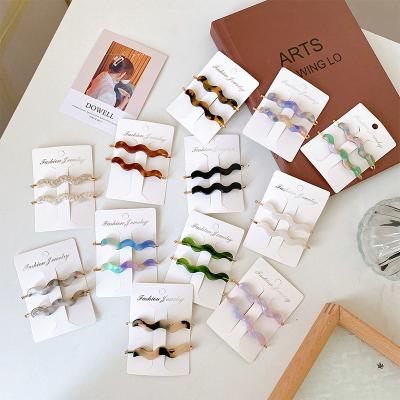 China DOWELL fashion cute side wave hair clips temperament bangs korean simple metal broken acetate single bangs for sale