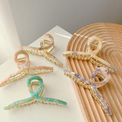 China DOWELL Fashion Flame Hairpin Wholesale Alloy Cavity Hair Accessories Korean Style Metal Claw Hair Clips for sale