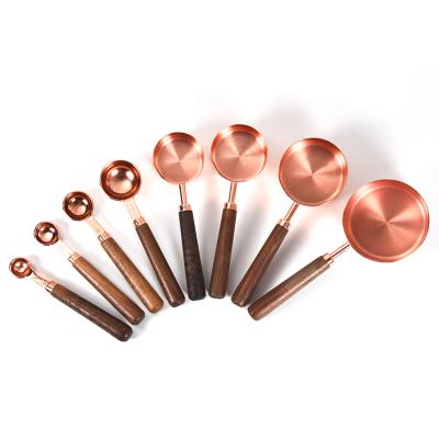 China Sustainable Cooking Tools Black Walnut Rose Gold Measuring Cups And Wood Handle Spoons Set Stainless Steel Measuring Cup Set Of 8 for sale