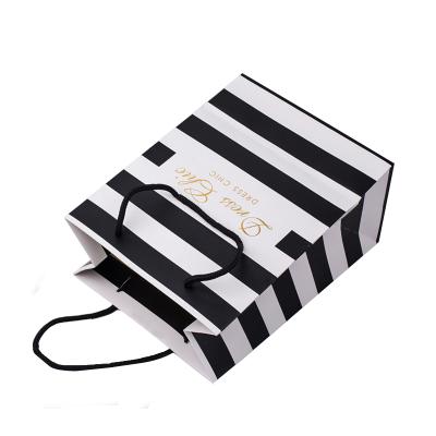 China Recyclable Luxury Black Cardboard Shopper Paper Shopping Bag With Custom Logo for sale