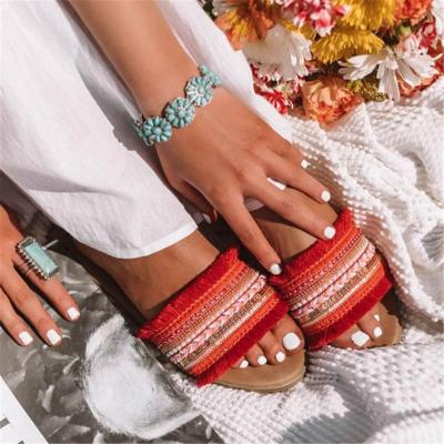 China LX-012 Bohemia Embroidery Band And Tassel Cross Strap Anti-slippery Open Toe Slipper For Women Ethnic Style Beach Flat Sandals Wholesale for sale