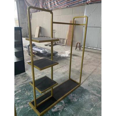 China Eco-friendly Simple European Style Gold Clothing Store Showcase Equipment Fixture Clothing Display Rack for sale