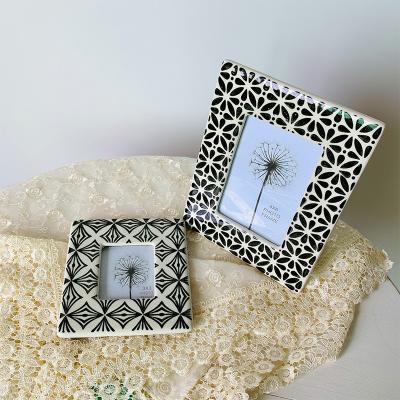 China Wholesale 3inch Modern Black Ceramic Hand Stamp Photo Frame For Home Or Hotel Decoration for sale