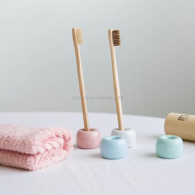 China Mini Ceramic Toothbrush Holder Porcelain Sustainable Toothbrush Holder Ring Bathroom Storage Organizer for sale