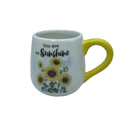 China Sustainable White Ceramic Coffee Mug With Sunflower Printing Yellow Handle for sale