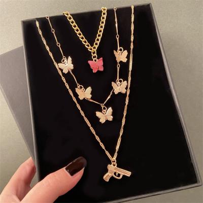 China Fashionable High Quality Bohemian Gold Layered Chain Necklace Butterfly Pendant Necklace Gun Snake Pendant For Women Gifts Jewelry for sale