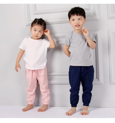 China Hot Sale Anti-Static Kids Clothes Fashion Mid-Waisted Soild Color Cotton Canvas Boys And Girls Harem Pants for sale