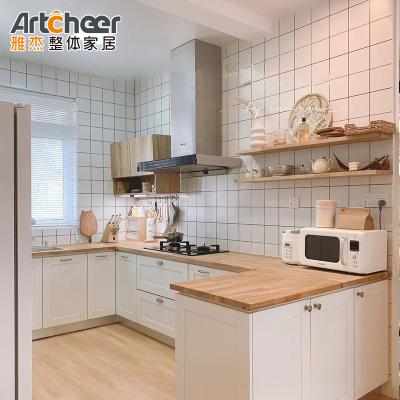 China Armarios de cocina modulares E0 2022 Tendencias de madera maciza con encimera de acero inoxidable en venta