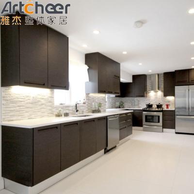 China Veneer Finish Dark Brown Kitchen Cabinets with Solid Wood Material and Handless Design for sale