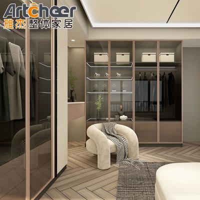 China Create a Chic Walk-In Closet with a Wardrobe Featuring Glass Doors and Accessories for sale