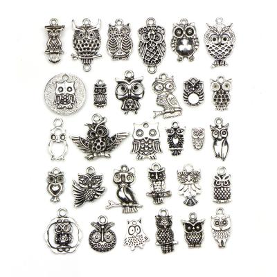 China Fancy Retro Custom Wavy Texture German Silver Plated Owl Retro Charm Pendant Jewelry Findings for sale