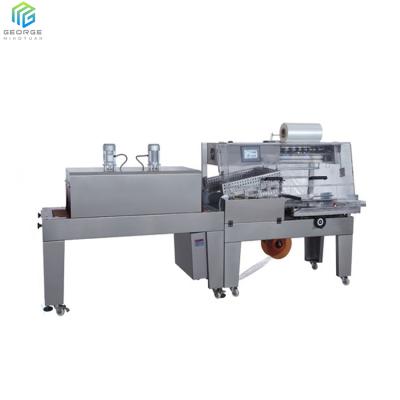 China CLOTHING Goods And Bottle Small Box Shrink Packing Machine High Quality Plastic Shrink Wrapping Machine for sale