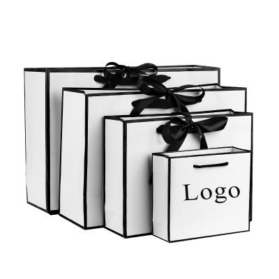 China Recyclable Paper Recyclable White Gift Wrapping Custom Shopping Paper Bag With Logo for sale