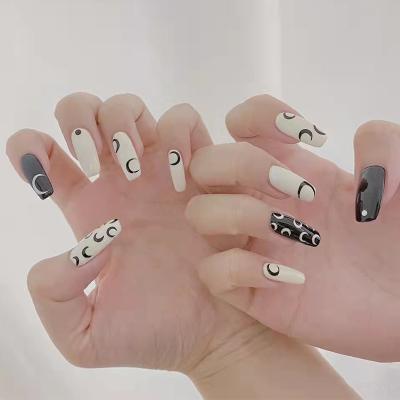 China Easy Apply Removable Colorful Reusable ABS Round Long Press On Fake Nails Black And White Moon Fake Nails for sale