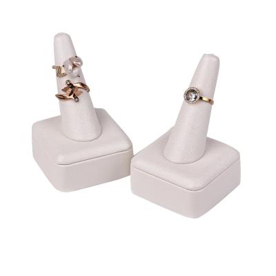 China High End New Arrival PU Finger Ring Holder Jewelry Display Rack White Cone Ring Display Stand for sale