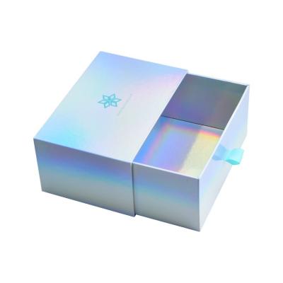 China Custom Fashion Luxury Silver Holographic Logo Laser Paper Beauty Handmade Cosmetics Packaging Gift Box Rigid Cardboard Sliding Drawer Box for sale