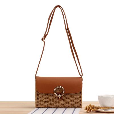 China Fashinable a new generation of one-shoulder femalbeach knitting braided bag summer leisure straw bag square buckle diagonal bag for sale