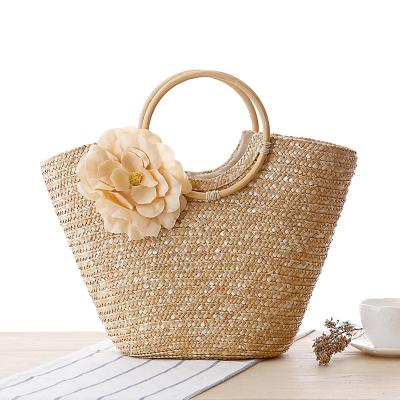 China Fashion Hot Selling New Cane Braids Handle To Braid Bag Flower Hand To Carry Straw Braid Bag Beach Bag for sale