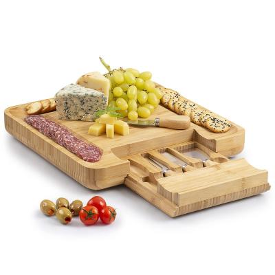 China Sustainable Hot Wooden Serving Tray Amazon Bamboo Cheese Board Set With Cutlery In Slide Out Drawer Cheese Tray Cutting Board Wholesale for sale