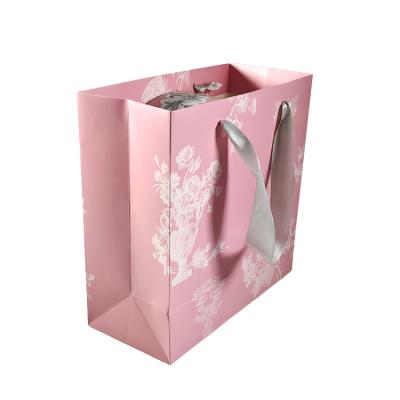 China Manufacturer Customize Your Own Logo Printing Luxury Gift Wrapping Recyclable Paper Shopping Bag With Handle for sale