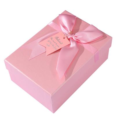 China Recyclable Custom Luxury Paper Packaging Square Box Lid And Base Pink Gift Box With Ribbon for sale