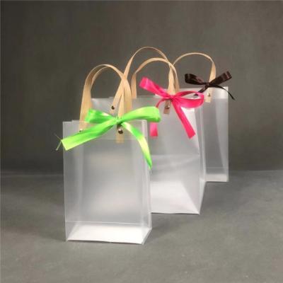 China Good Quality PP Wrapped Frosted Plastic Bag With Ribbon Fashion Popular Cheap Style Frosted PP Plastic Bag With Ribbon for sale