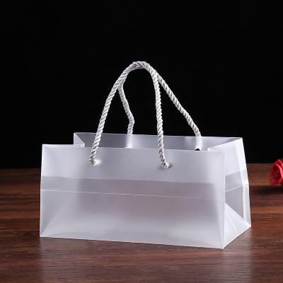 China Packaging Box Most Popular Frosted White PP Plastic Bag PP Bag With Handle Customized Gift Bag for sale