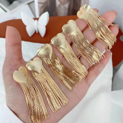 China Environmental Friendly Luxury Long Chain Heart Gold Tassel Drop Earrings for sale