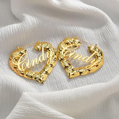 China Best Simple Hollow Heart Earrings Gold Plated Hoop Earrings Stainless Steel Heart Hoop Earrings for sale