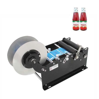 China Simple Cheap Desktop Horizontal Food Wine Vial Adhesive Sticker Manual Labeling Machine Plastic Wine Bottle Carton Packing Type for sale