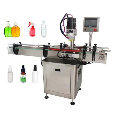 China Automatic Pneumatic Food Lidder Equipment Plastic Dropper Bottle Glass Lidding Jar Machines With Conveyor for sale