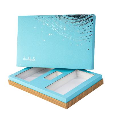 China Recyclable Custom Logo Luxury Blue Rigid Paper Cosmetic Cardboard Lid And Button Packaging Gift Boxes With Insert for sale