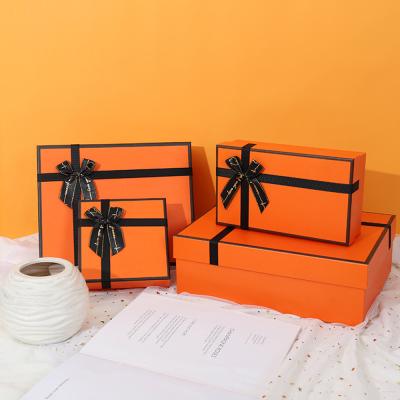 China Recyclable Custom Orange Luxury Greyboard Lid and Base 2 Piece Rigid Cardboard Christmas Gift Packaging Box for sale