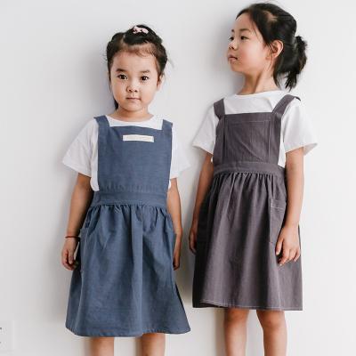 China Factory price direct sales cute chef apron style kids solid color canvas cotton cleaning apron for sale