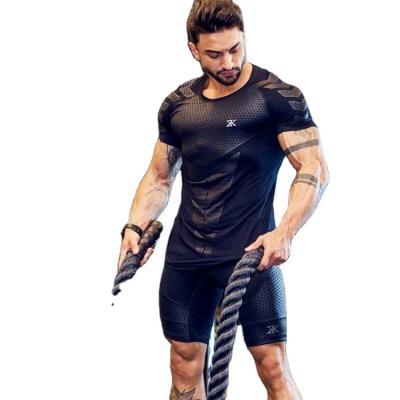 China Anti-wrinkle low price fitness apparel sports t-shirt muscle tights apparel male high-elastic short-sleeved training fitness apparel for sale