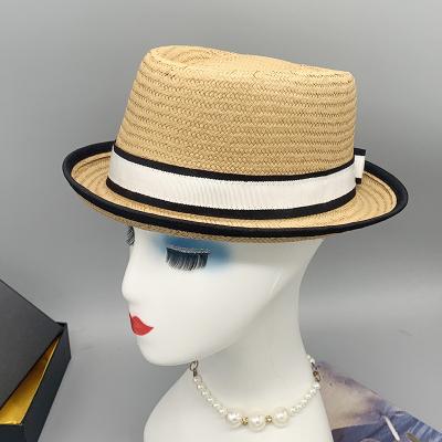 China Custom Character Logo Roll Up Wide Brim Fedora Hat With Bow Panama Beach Summer Straw Hat for sale