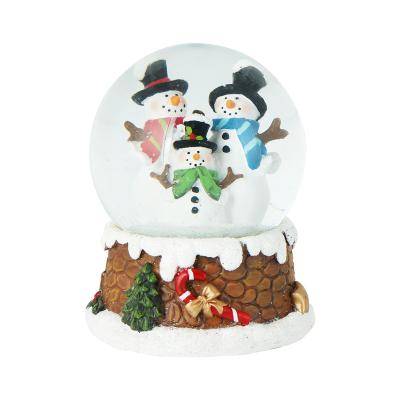 China Europe Christmas Snowman Family Music Box Ornament Decorative Resin Water Snow Glass Globes for sale