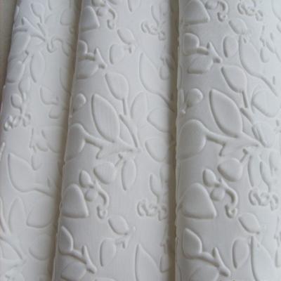 China Antistatic Scuba Textile White Color 75D Polyester DTY Spandex Embossed 3D Scuba Knit Fabric for sale