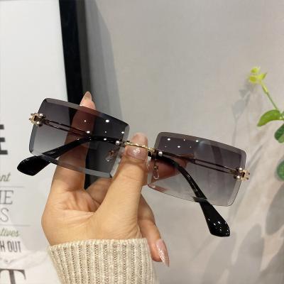 China Fashion Sunglasses Wholesale Manufacturers Designer Small Rimless Sun Lenses Shades 2021 Men Women Sunglasses 2020 for sale