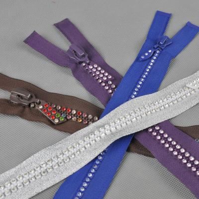 China Viable Garment Accessories Craft Dressing Zipper Open End Diamond Resin Zipper Sewing Slider for sale