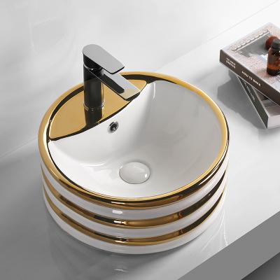 China 2022 Manufacturer Bathroom Sanitary Accessories Easy Clean Ceramic Wash Basin Gold Plated Round Shape With Diamond Design for sale