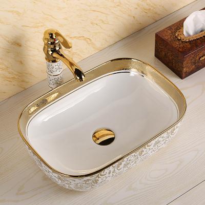 China Modern Luxury Bathroom Gold Color Bathroom Basin Double-flow Porcelain Countertop Vessel Sink Hand Electroplating Gold Ceramic Wash Basin for sale